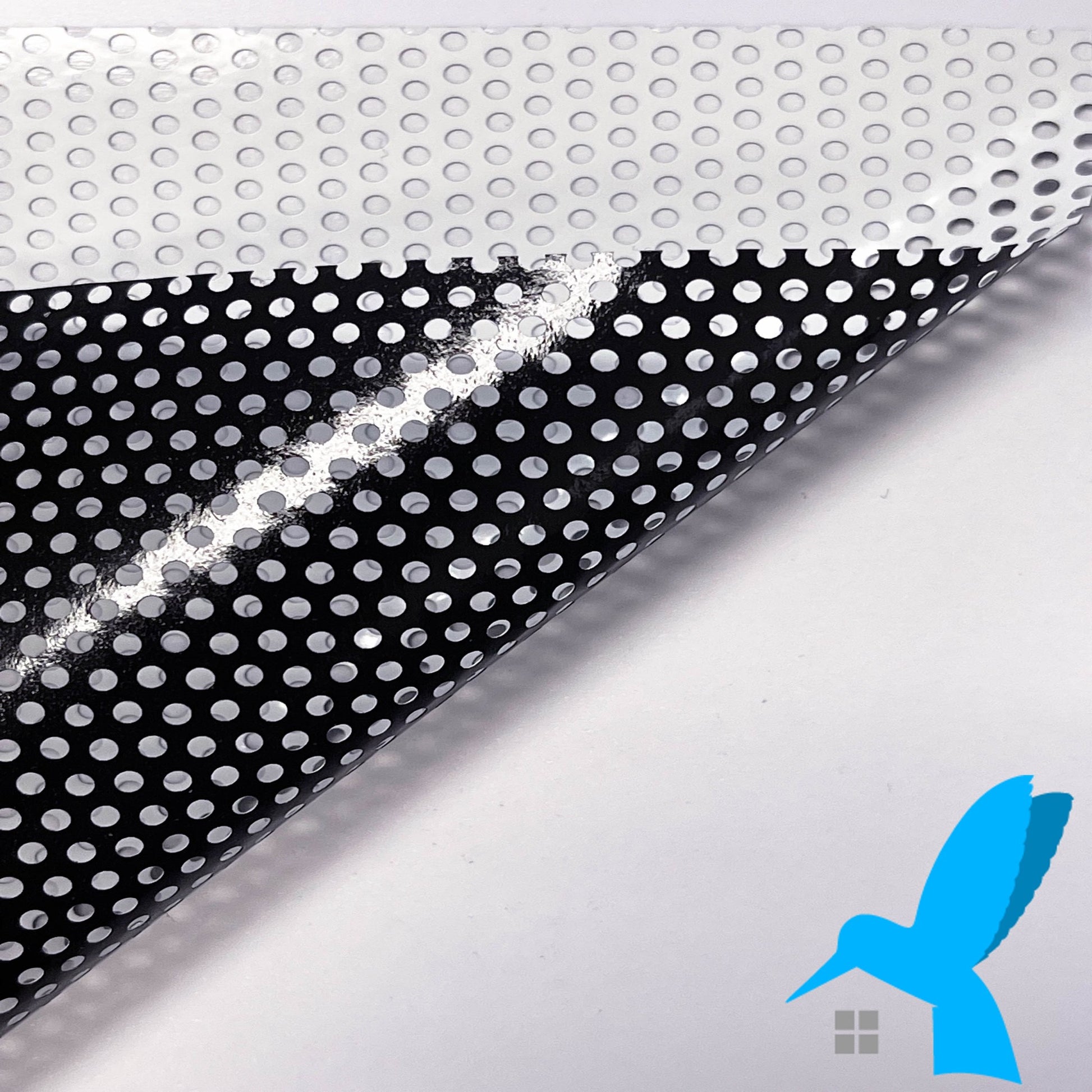 Bird Strike window film white - A white-on-black perforated window film product developed to prevent birds from colliding into glass windows.